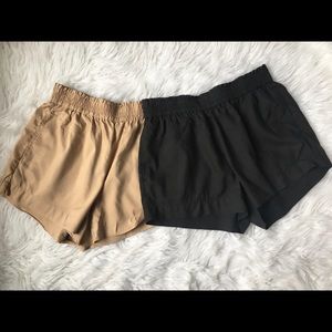 beige and black flowy shorts.